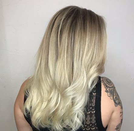 Long blonde balayage with a soft rooted shadow