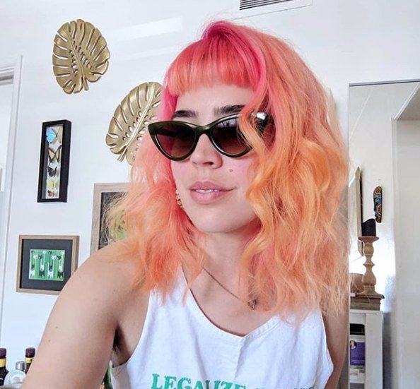 Peach fashion color with curtain bangs